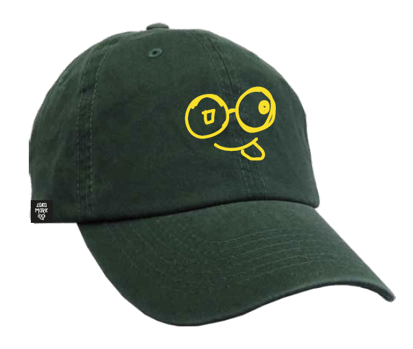 Angled front view of washed green dad hat with yellow glasses-face logo and curved brim against a white background