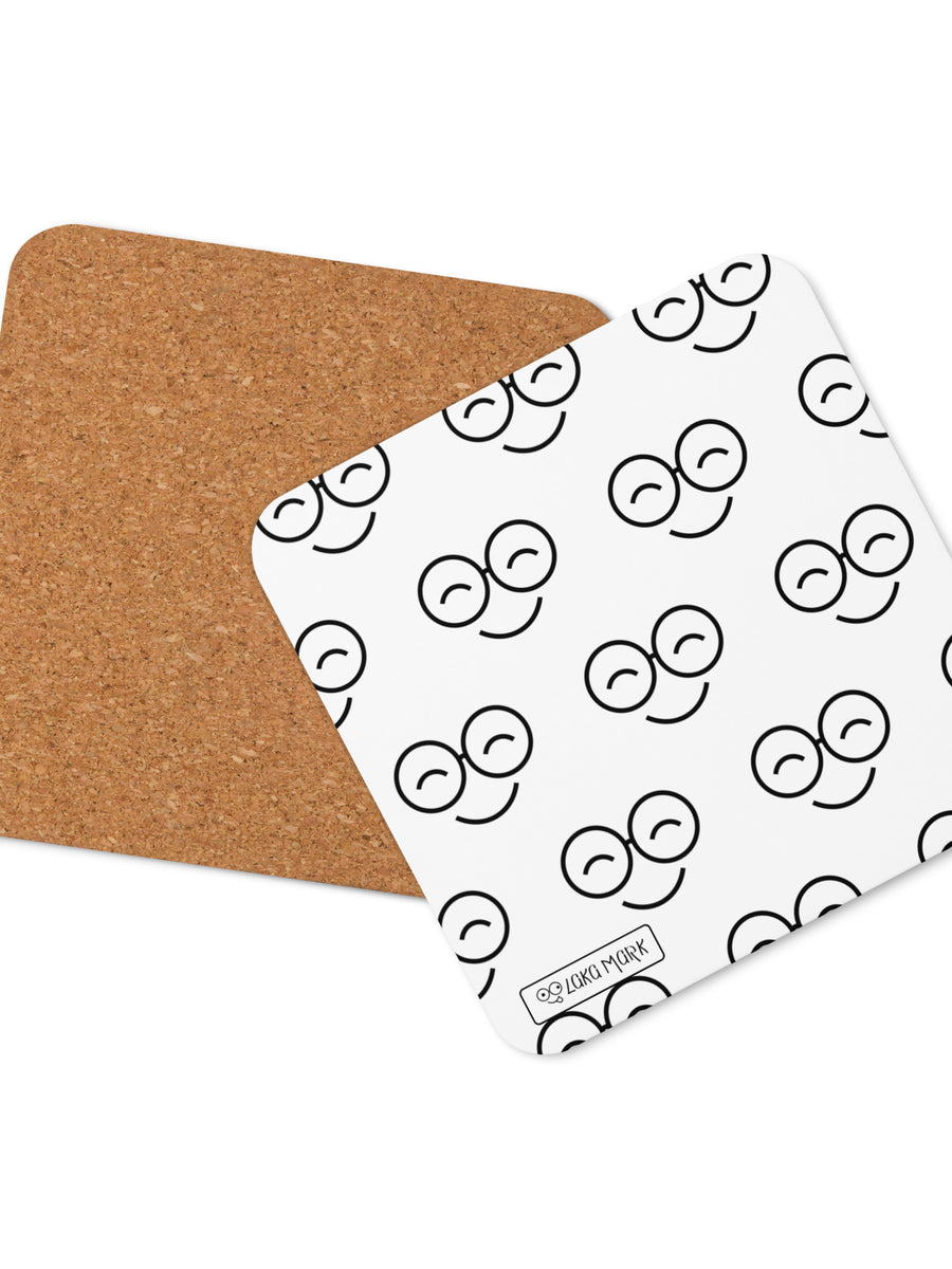 White square coaster with repeating black smiling glasses pattern, rounded corners and brown backing shown behind it