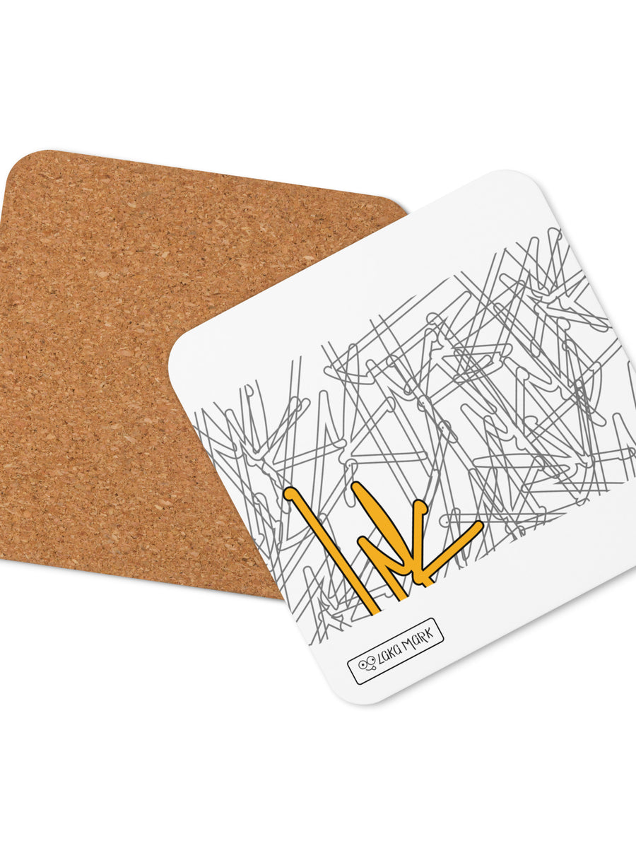 White square coaster with fine grey abstract line art and a yellow graphic accent, shown with brown backing