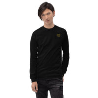 Model wearing a black long sleeve t-shirt with ribbed cuffs and a yellow glasses-face chest design