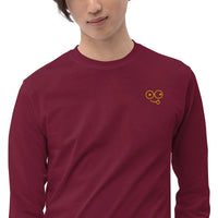 Close-up of a maroon crew neck t-shirt showing the yellow tongue-out glasses-face chest design