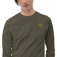 Close-up of a military green crew neck t-shirt showing the yellow tongue-out glasses-face chest design