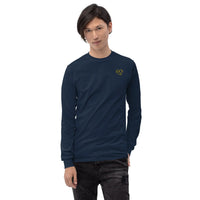 Model wearing a navy long sleeve t-shirt with ribbed cuffs and a yellow glasses-face chest design