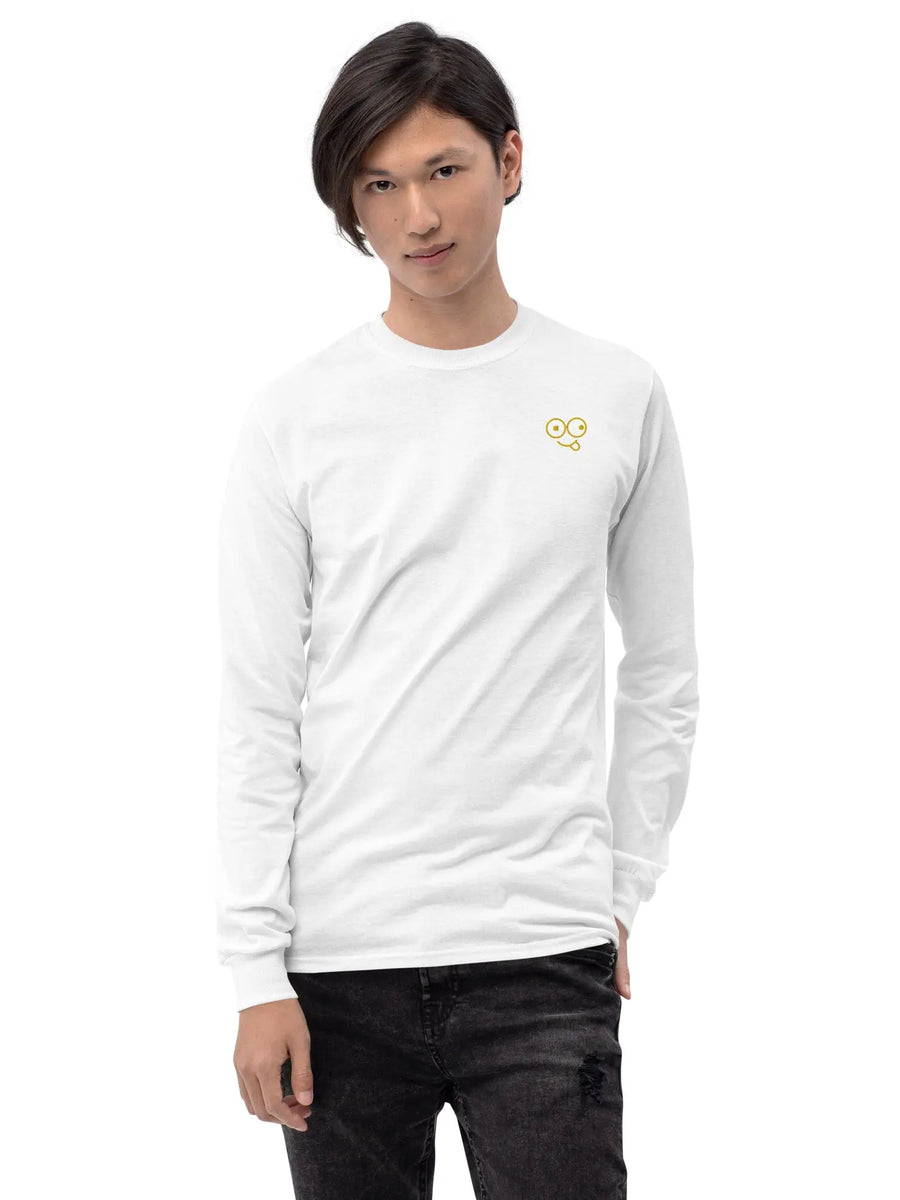 Model wearing a white long sleeve crew neck t-shirt with a small yellow glasses-face chest design
