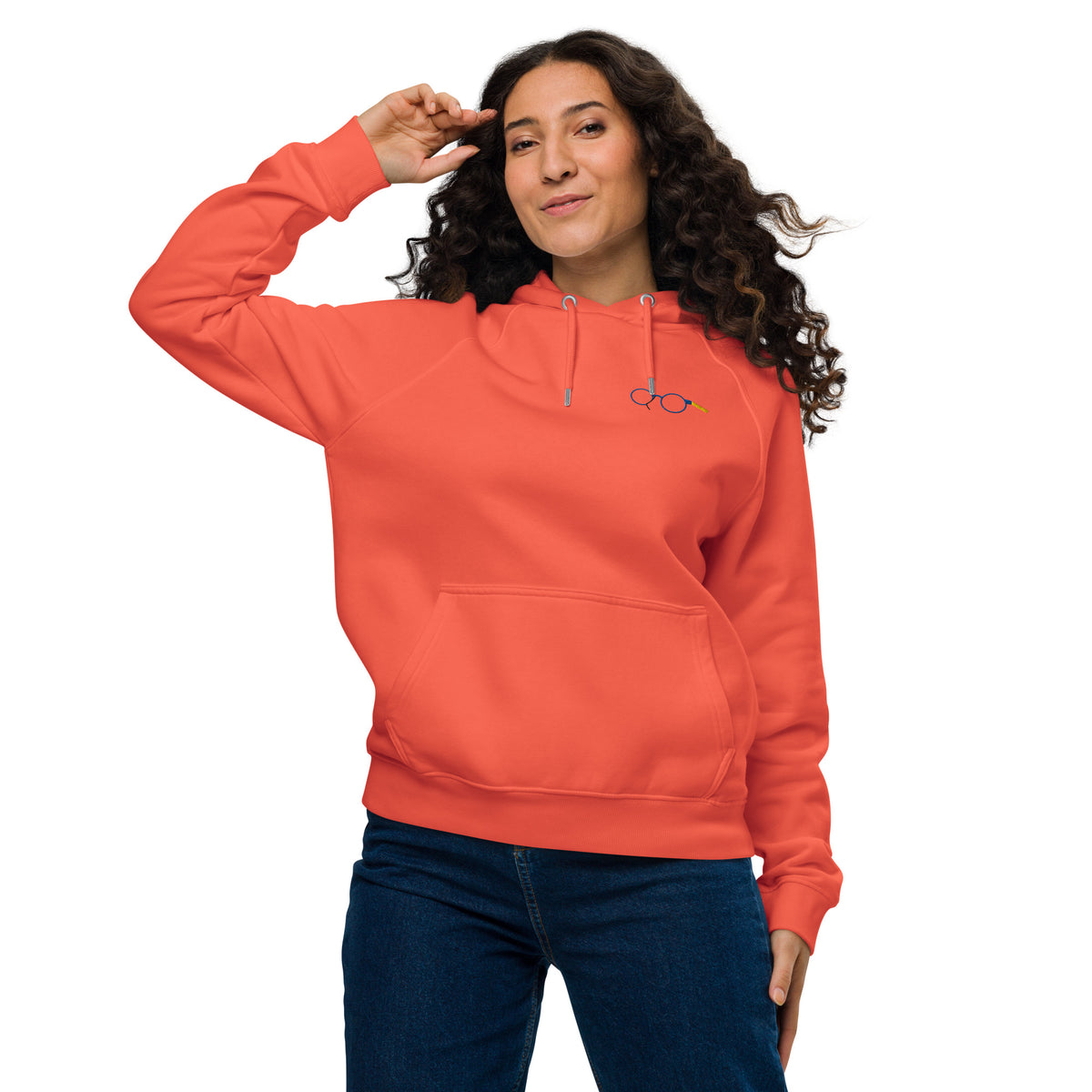 Model wearing an orange unisex raglan hoodie with glasses chest graphic, drawstring hood and kangaroo pocket