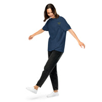 Model wearing a true navy heavyweight cotton t-shirt with a small yellow glasses-face chest design