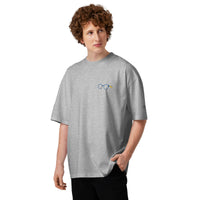 Model wearing a heather grey oversized t-shirt with dropped shoulders and a small glasses chest graphic
