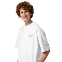 Angled view of white oversized t-shirt showing glasses chest graphic and glasses-face sleeve design