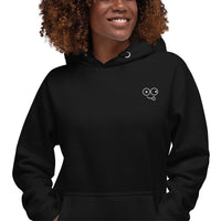 Close-up of a black hoodie showing the white tongue-out glasses-face chest design