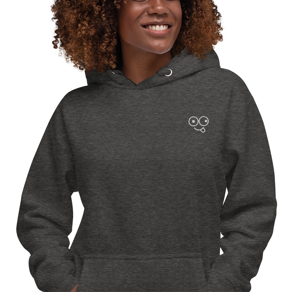Close-up of a charcoal heather hoodie showing the white tongue-out glasses-face chest design
