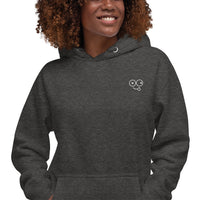 Close-up of a charcoal heather hoodie showing the white tongue-out glasses-face chest design