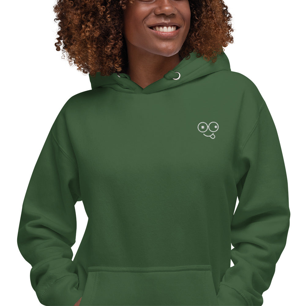Close-up of a forest green hoodie showing the white tongue-out glasses-face chest design