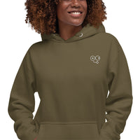 Close-up of a military green hoodie showing the white tongue-out glasses-face chest design