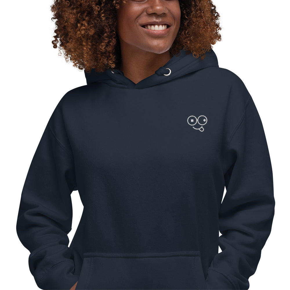 Close-up of a navy blazer hoodie showing the white tongue-out glasses-face chest design