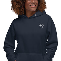 Close-up of a navy blazer hoodie showing the white tongue-out glasses-face chest design