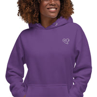 Close-up of a purple hoodie showing the white tongue-out glasses-face chest design