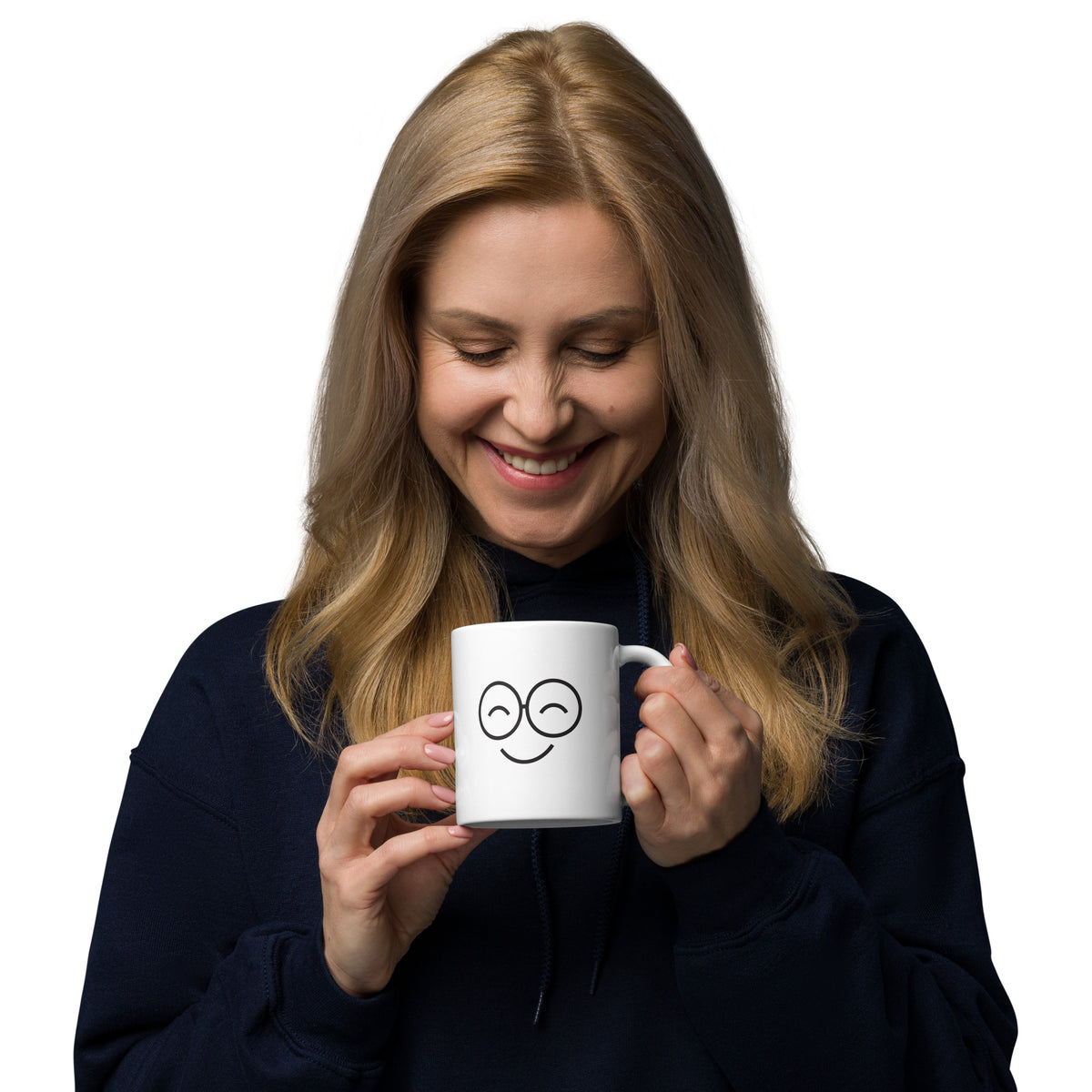 Person holding a white smiling-face mug near their chin, showing black round glasses and a left-side handle